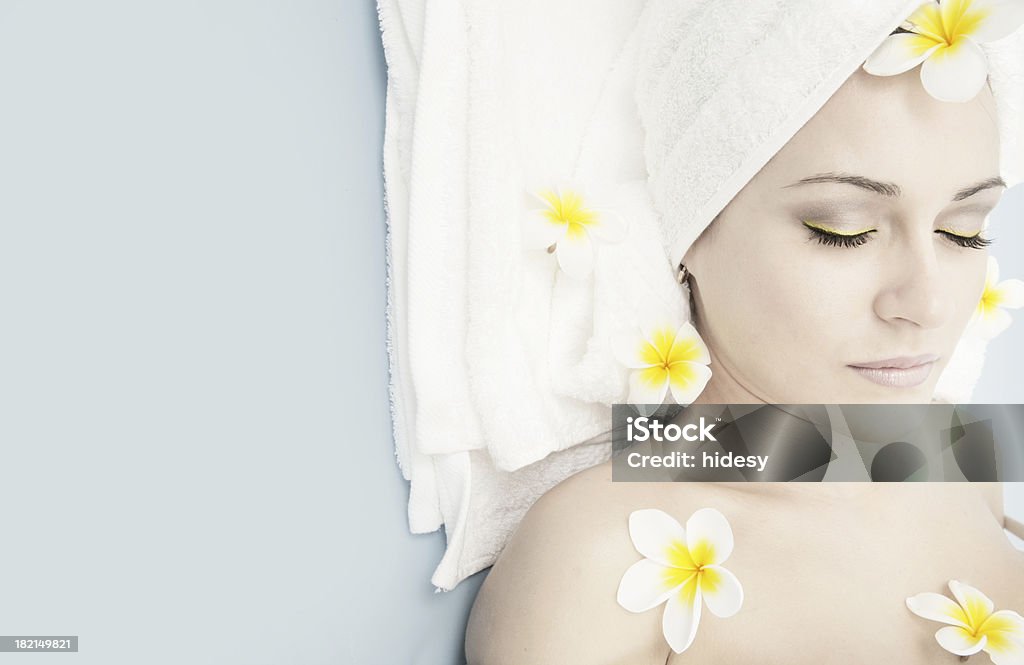 Peaceful Treatment Woman and plumeria on a towel 16-17 Years Stock Photo