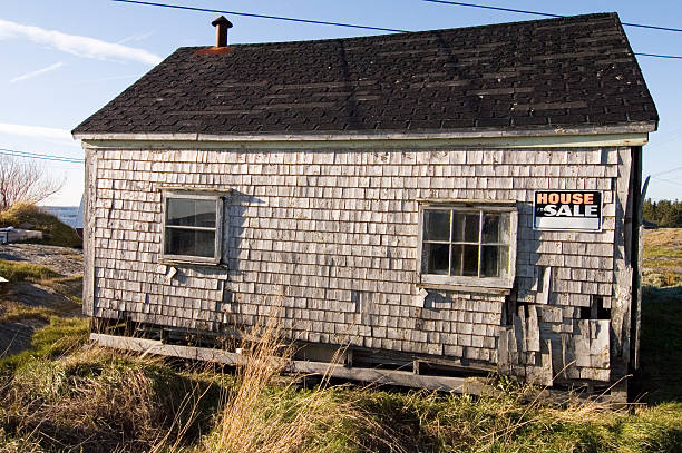 decaying house for sale stock photo