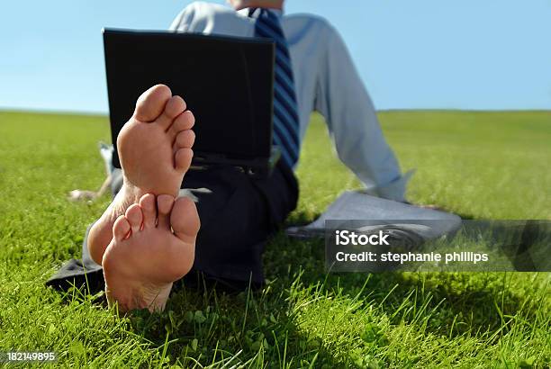 Businessman Sitting In The Grass With Bare Feet Stock Photo - Download Image Now - Business, Adult, Adults Only