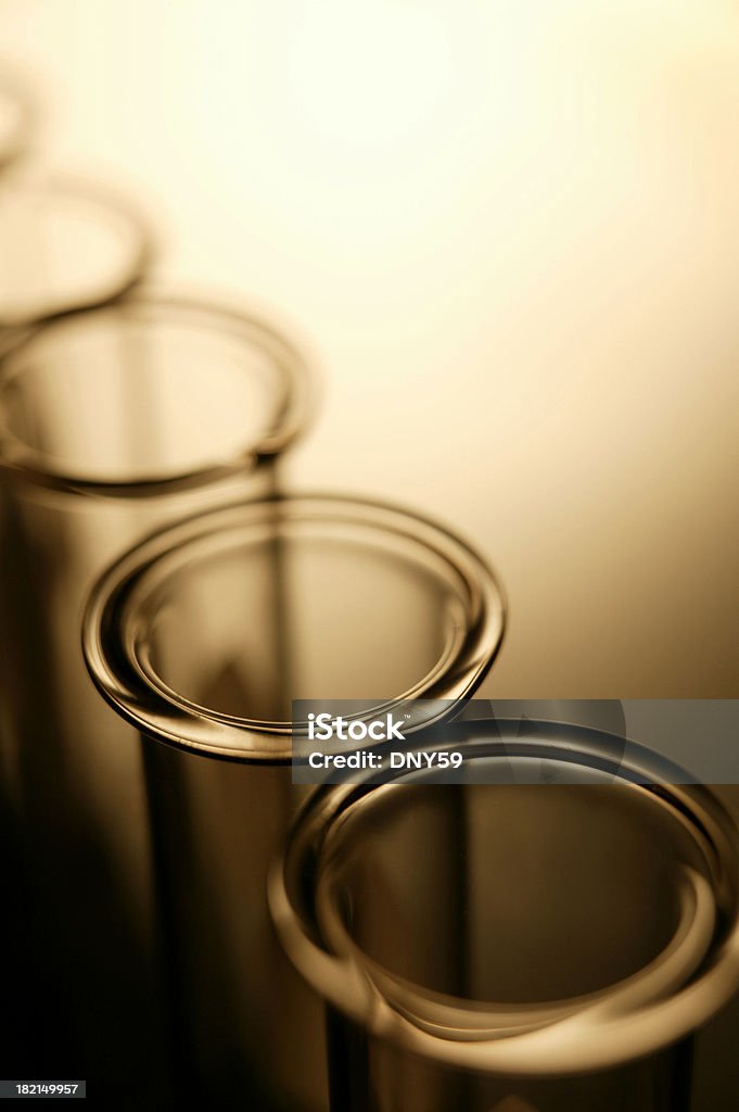 Test Tube 1 Row of test tubes in dramatic lighting with room for body copy Biology Stock Photo