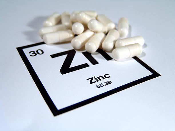 Zinc Supplements Zinc supplements on their periodic table square. zinc stock pictures, royalty-free photos & images