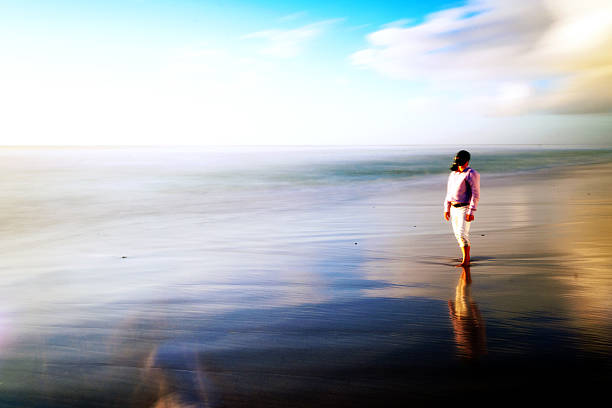 istock Man with gas mask standing on the beach 182150427
