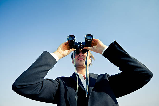 istock Business Man with Binoculars Searching New Opportunities 182150434