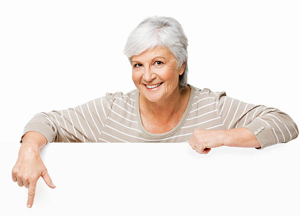 istock Elderly Woman Pointing Over a Wall - Isolated 182150453