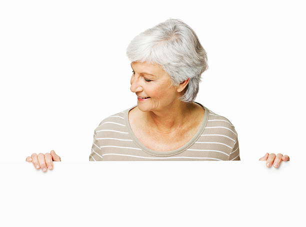 istock Elderly Woman Looking Over a Wall - Isolated 182150455