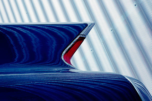 Classic Car Tail Fin Against Corrugated Iron Metal Wall abstract pattern reflected on american classic car detail, Cadillac Coupe De Ville  tail fin photos stock pictures, royalty-free photos & images
