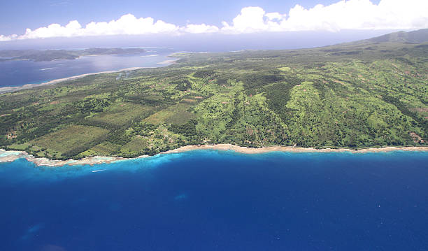 aerial view of Taveuni Island in Northern Fiji "Helicopter view of part of Taveuni Island in Northern Fiji, showing the reef and the open land." taveuni stock pictures, royalty-free photos & images