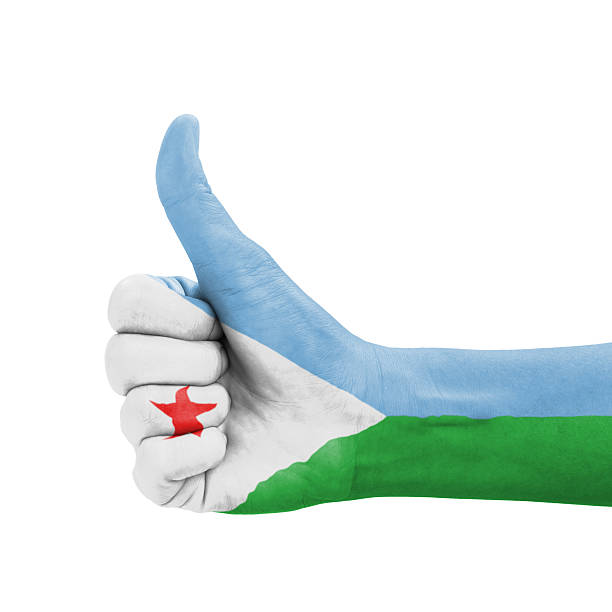 Flag of Djibouti waving in the wind against deep blue sky. Djiboutian flag.