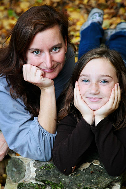 istock Beautiful Mother and Daughter Looking at Camera 182151127