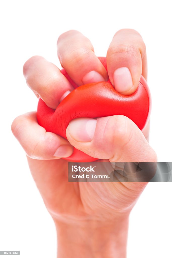 Mãos apertando Stress Ball - Foto de stock de Stress Ball royalty-free