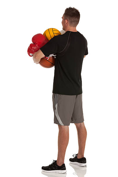 istock Man holding sports equiments 182151696