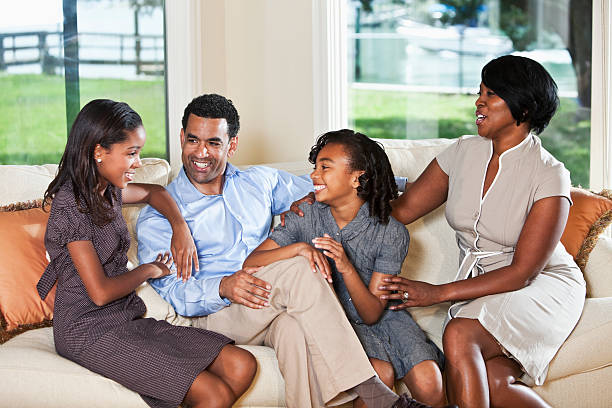 istock African American family at home on sofa 182151993