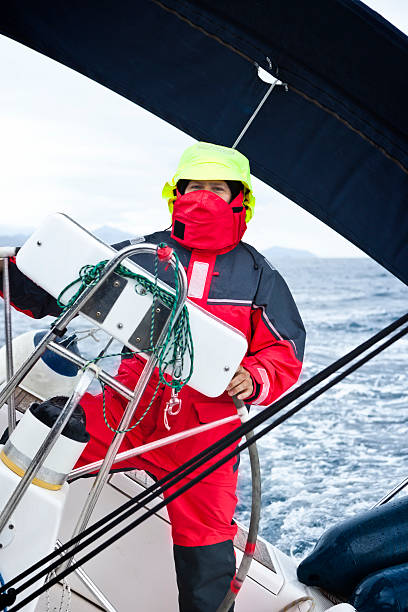 istock Skipper driving sailboat in bad weather 182152496