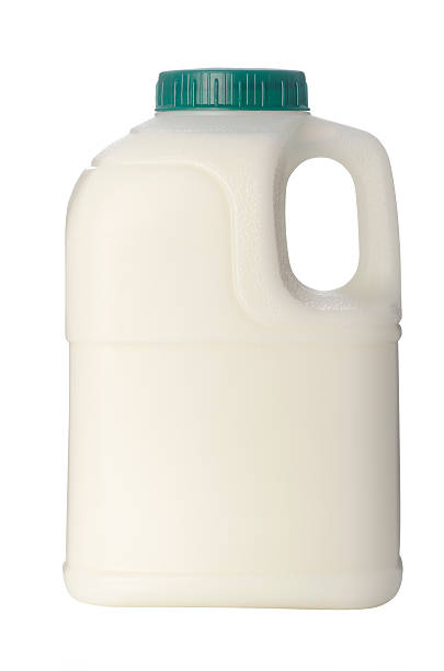 istock White plastic milk carton with green lid 182152900