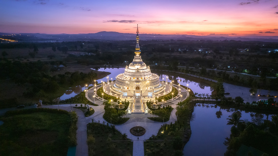 Beautiful Aerial view White Pagoda at Wat Sangtham in sunset time at Wang Nam Khiao District, Nakhon Ratchasima Thailand.