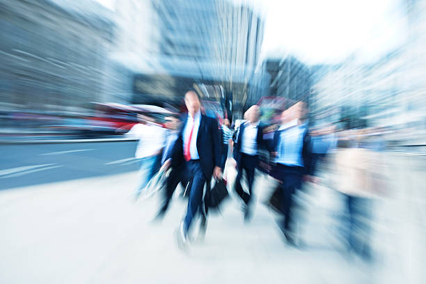 istock Business Commuters Walking Down Street, Blurred Motion, London, England 182153610