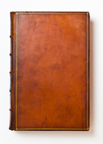 Rich brown leather book cover that's over 200 years old. Only centuries of age can produce such a rich patina and lovely wear.