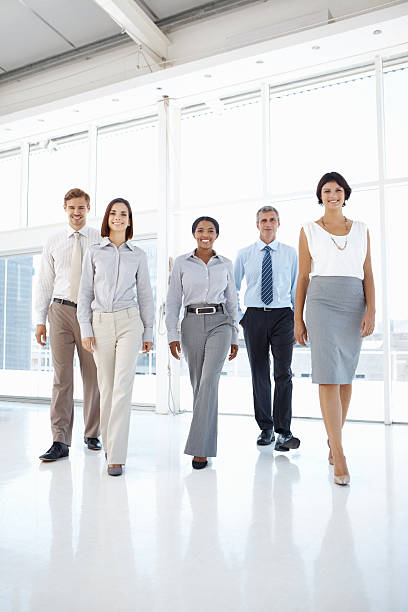 istock Successful business team walking towards you 182153926