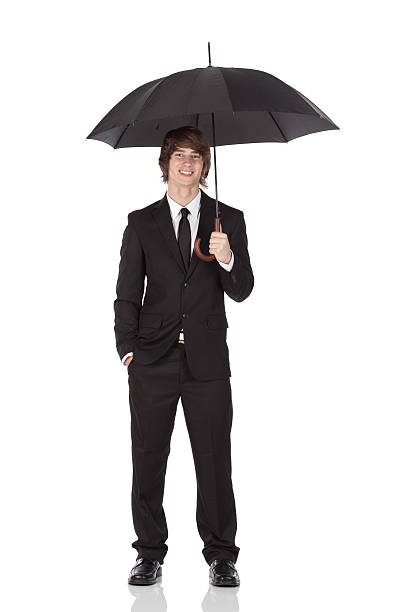 istock Businessman holding an umbrella 182153947