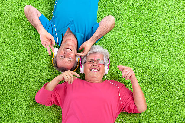 istock happy senior couple on green carpet 182154009