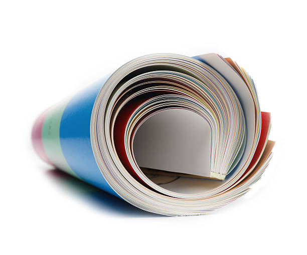 rolled magazine magazine rolled on white rolled up magazine stock pictures, royalty-free photos & images