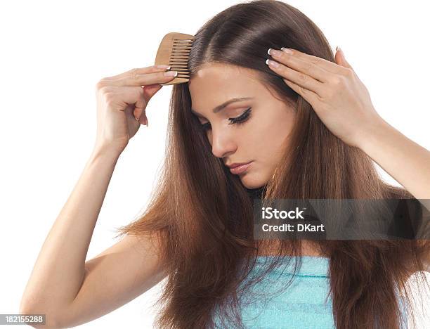 Young Brunette Lady Combing Her Beautiful Long Hair Stock Photo - Download Image Now