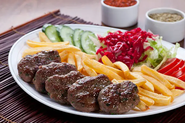 "Meatballs as a Kofte. Traditional Turkish food. It consists of meat lamb with herbs, often including parsley and mint. Food image. More photos like this here:"