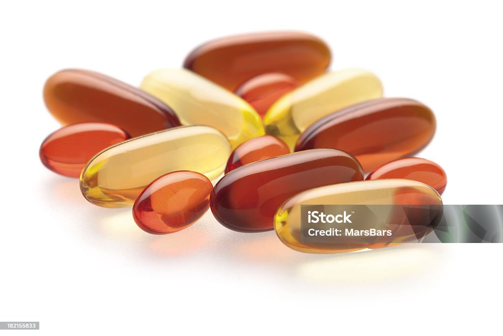 Gel compléments de vitamines sur blanc - Photo de Antioxydant libre de droits