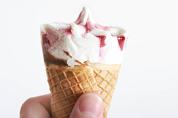 istock strawberry ice cream in hand 182156783