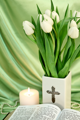 Easter scripture from Mark  with cross, candle and tulips.