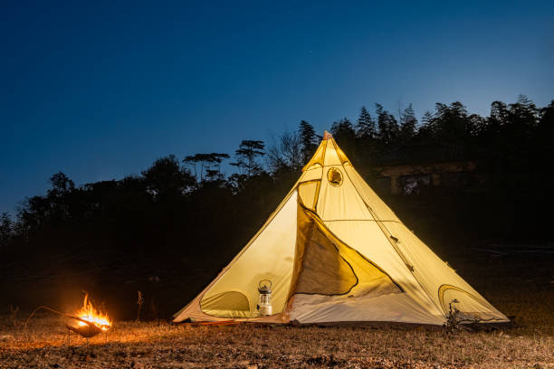 istock Pyramid tent and bonfire at night 1821570339