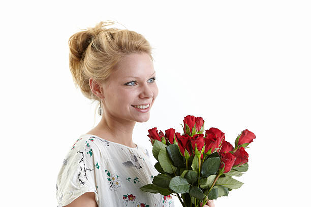 istock Beautiful young woman with red roses 182157114