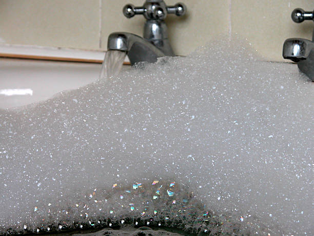 Bubbles and bath taps. stock photo