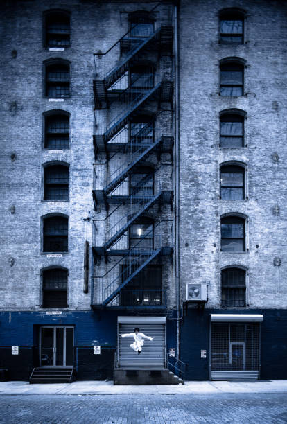 Kung Fu Warrior leaping from an abandoned building - tilt shift image for selective focus.