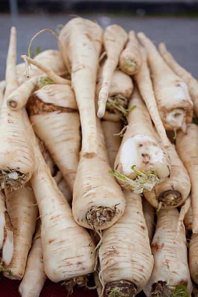 istock Parsnips in a stack at the farmer's market 182158449