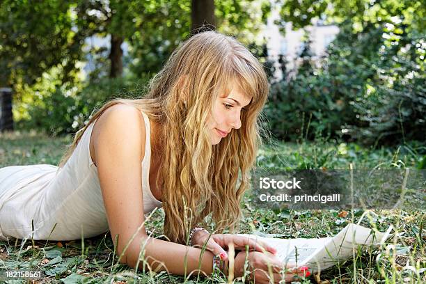 Young Woman Reading In The Park Stock Photo - Download Image Now - Women, Adult, Beautiful People