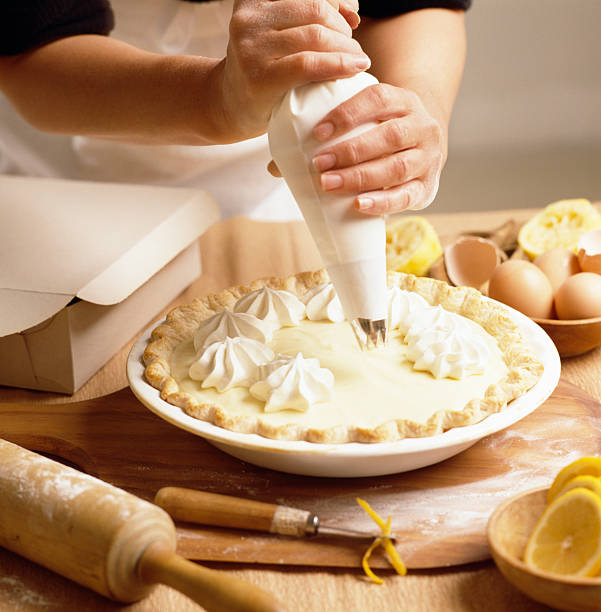 Lemon Tart citrus cake in wood dish and white cloth background, cake and bakery concept