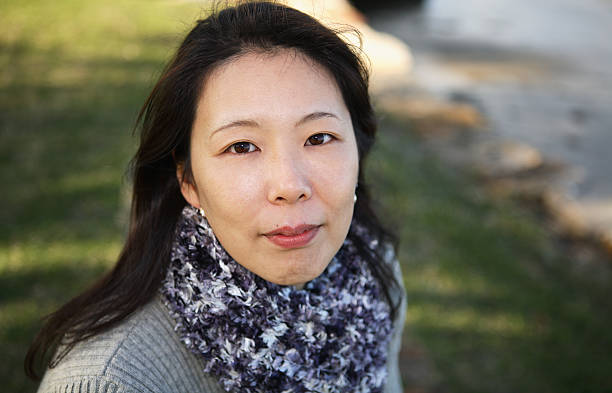 istock Woman in a park 182159454