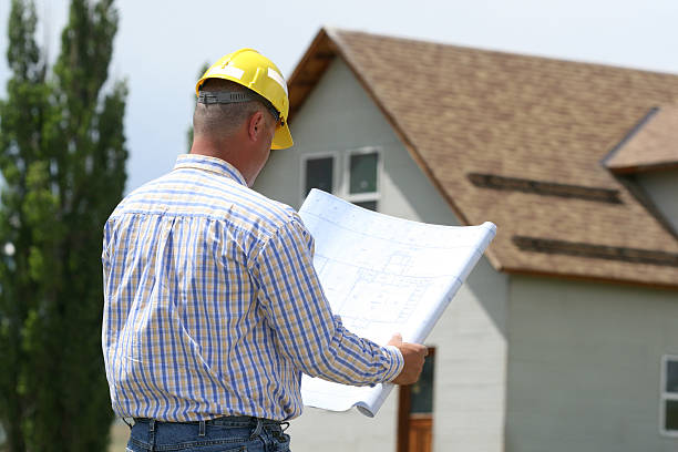 istock Contractor Reviewing Plans 182159973