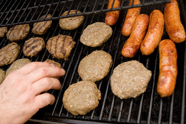watch out dont burn your hand on the bbq stock photo
