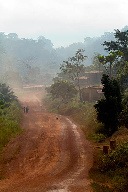uniformed women walking on the road connecting the international airport with the African city of Libreville, capital of the Republic of Gabon