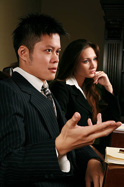 Young Business People Two young business people in a conference room modelkt stock pictures, royalty-free photos & images