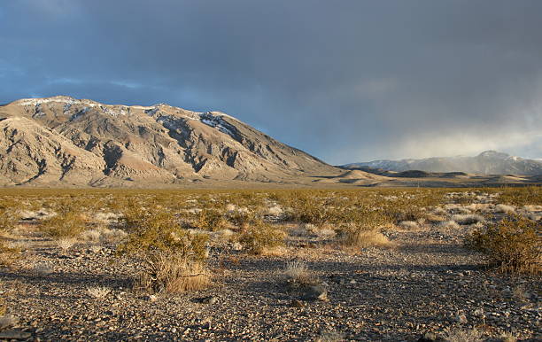 Sunlit mountains with clouds stock photo