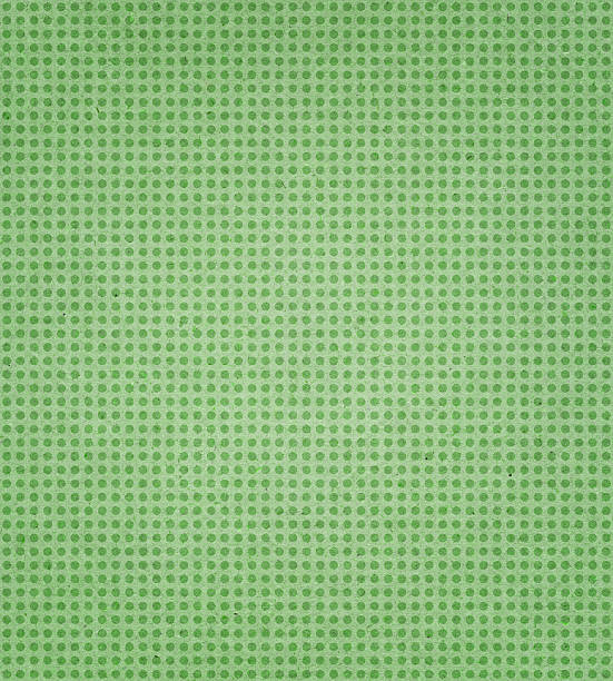 istock green paper with polka dots 182160717
