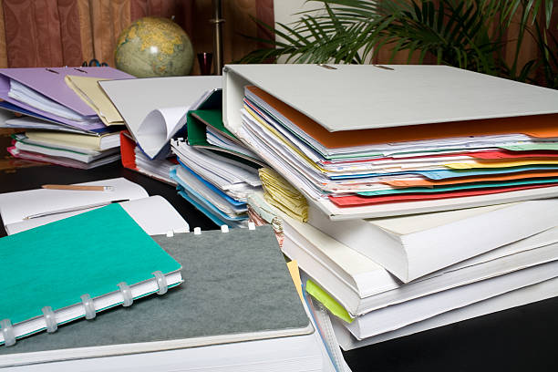 istock Office desk up close, cluttered with stuff 182160947