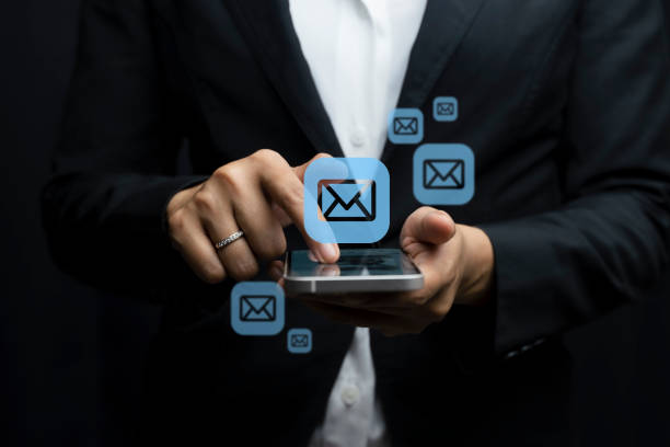istock Email marketing concept. Hand of businessman using smartphone , tablet, for email virtual screen. Business digital technology and marketing. 1821612610