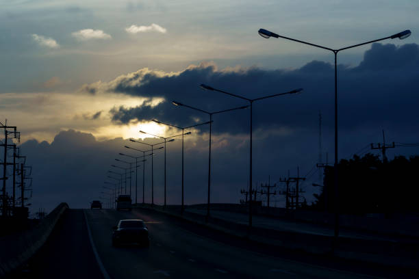 istock Road bridges and light pole on sunset sky scenery. silhouette. 1821616765