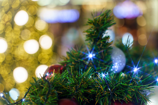 Festive Christmas eve decorated in shopping mall with balls and bokeh background in the shopping mall.