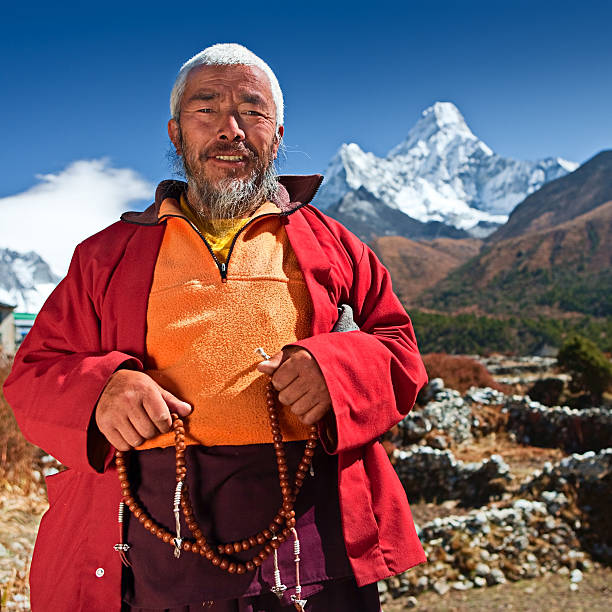 Mantra of Avalokiteshvara carved on a large rock in the Khumbu region of Everest within the Mt Everest National Park.  These Buddhist Mantras carved in Sanskrit are seen in many places throughout Nepal.