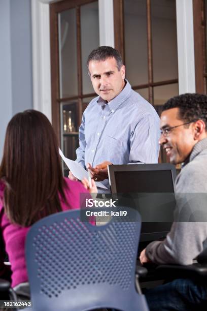 Instructor Talking With Continuing Education Students Stock Photo - Download Image Now